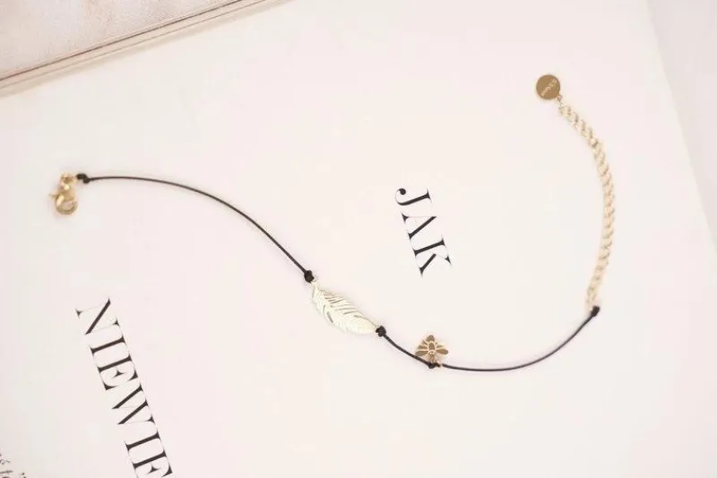 Best Damska Bransoletka Czarny Sznurek Celebrytka Złota Pióro Cleopatra Bransoletki